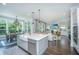 Open-concept kitchen featuring a large island, modern appliances, and seamless access to the dining area at 2962 Clearwater Dr, Mount Pleasant, SC 29466