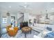 Spacious living room with staircase, white sectional, hardwood floors, and open concept layout at 2962 Clearwater Dr, Mount Pleasant, SC 29466