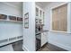 Mud room with storage including hooks, shelves, cabinets, wine cooler and beverage area at 2962 Clearwater Dr, Mount Pleasant, SC 29466