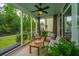 Inviting screened porch with comfortable seating and views of the lush green yard at 2962 Clearwater Dr, Mount Pleasant, SC 29466