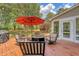 Outdoor back deck with chairs, firepit, grill and views of the lush backyard at 322 Clubview Rd, Summerville, SC 29485