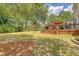 Enjoy outdoor living on the deck with a view of the spacious backyard and lush landscaping at 322 Clubview Rd, Summerville, SC 29485