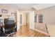 Bedroom with wood floors, marimba, and doorway to the bathroom at 322 Clubview Rd, Summerville, SC 29485