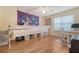 Spacious room featuring hardwood floors, a crafting machine, and natural light at 322 Clubview Rd, Summerville, SC 29485