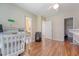 Bedroom featuring desk, hardwood floors, and access to adjacent rooms at 322 Clubview Rd, Summerville, SC 29485