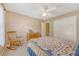 Bedroom with a window, hardwood floors, and a patterned quilt on the bed at 322 Clubview Rd, Summerville, SC 29485