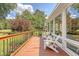 The deck is perfect for relaxing, complete with comfortable seating and views of the serene backyard at 322 Clubview Rd, Summerville, SC 29485
