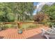 Enjoy outdoor living on this spacious deck with views of the landscaped backyard and lush greenery at 322 Clubview Rd, Summerville, SC 29485