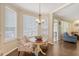 Cozy dining area with large windows and access to the living room at 322 Clubview Rd, Summerville, SC 29485