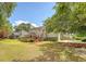 Enjoy outdoor living with a spacious backyard, large deck, and lush green landscaping at 322 Clubview Rd, Summerville, SC 29485