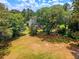 Charming two-story home with a well-maintained lawn and mature trees on a sunny day at 322 Clubview Rd, Summerville, SC 29485