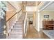 Inviting entryway with a staircase, wood floors, and view into the living room at 322 Clubview Rd, Summerville, SC 29485
