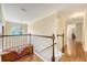 Bright hallway features hardwood floors, a staircase, and a large arched window for natural light at 322 Clubview Rd, Summerville, SC 29485