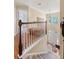 Bright upstairs hallway featuring an overhead chandelier and a view of the front door and entryway at 322 Clubview Rd, Summerville, SC 29485