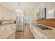 Stylish kitchen features white cabinets, granite countertops, and stainless steel appliances at 322 Clubview Rd, Summerville, SC 29485