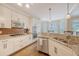 Well-lit kitchen with stainless steel appliances, granite counters, and a view of the eat-in breakfast nook at 322 Clubview Rd, Summerville, SC 29485
