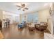 Open living room with hardwood floors, comfortable seating, and an open concept kitchen at 322 Clubview Rd, Summerville, SC 29485