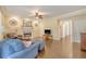 Comfortable living room with hardwood floors, a fireplace, and a ceiling fan at 322 Clubview Rd, Summerville, SC 29485