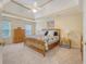 Serene main bedroom with a wood bed, neutral tones, and a window providing natural light at 322 Clubview Rd, Summerville, SC 29485