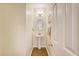 Compact powder room featuring a pedestal sink, wood floors, and neutral decor at 322 Clubview Rd, Summerville, SC 29485