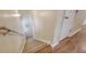 Carpeted staircase with railing, hardwood floors, and neutral color scheme at 322 Clubview Rd, Summerville, SC 29485
