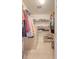 Organized walk-in closet with shelving, hanging space, and neutral tile flooring at 322 Clubview Rd, Summerville, SC 29485