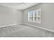 Spacious bedroom showcasing plush carpet, a ceiling fan and shuttered window at 327 Tupelo Lake Dr, Summerville, SC 29486