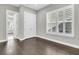 Bedroom with walk-in closet, hardwood floors, natural light and white window shutters at 327 Tupelo Lake Dr, Summerville, SC 29486