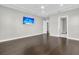 This bright, spacious bedroom offers tray ceiling, wood floors and serene neutral walls at 327 Tupelo Lake Dr, Summerville, SC 29486