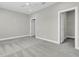 Empty bedroom featuring a ceiling fan, plush carpet and two closets at 327 Tupelo Lake Dr, Summerville, SC 29486