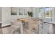 Cozy dining area features modern furniture, hardwood floors, and bright natural light from a sliding glass door at 327 Tupelo Lake Dr, Summerville, SC 29486