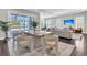 Dining room features sleek modern furnishings, hardwood floors, and sliding glass door to the outdoors at 327 Tupelo Lake Dr, Summerville, SC 29486