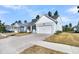 Charming single-story home with a two-car garage and well-manicured lawn at 327 Tupelo Lake Dr, Summerville, SC 29486