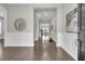 Elegant foyer with dark hardwood floors and white wainscoting at 327 Tupelo Lake Dr, Summerville, SC 29486