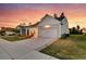 Lovely home exterior displaying a neat lawn, stylish garage door, and a cozy front porch at 327 Tupelo Lake Dr, Summerville, SC 29486