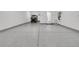 Spacious garage with epoxy flooring, perfect for storage and projects at 327 Tupelo Lake Dr, Summerville, SC 29486
