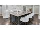 Spacious kitchen island with granite countertops and barstool seating at 327 Tupelo Lake Dr, Summerville, SC 29486