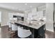 Spacious kitchen showcases a large center island with counter seating, granite countertops and stainless appliances at 327 Tupelo Lake Dr, Summerville, SC 29486