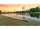 Panoramic lake view with reflections of trees and houses at sunset at 327 Tupelo Lake Dr, Summerville, SC 29486