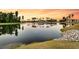 Picturesque lake view featuring a calm surface and colorful sunset backdrop at 327 Tupelo Lake Dr, Summerville, SC 29486