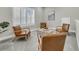 Modern living room with shuttered windows, neutral tones and comfortable seating at 327 Tupelo Lake Dr, Summerville, SC 29486