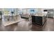 Bright living space featuring hardwood floors, a lake view, and modern furnishings at 327 Tupelo Lake Dr, Summerville, SC 29486