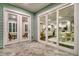Covered patio offering views of interior spaces through large glass doors and windows at 327 Tupelo Lake Dr, Summerville, SC 29486