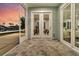 Relaxing screened porch featuring tiled flooring and sunset lake view at 327 Tupelo Lake Dr, Summerville, SC 29486