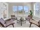 Inviting sitting area boasts hardwood floors, natural light from picture windows and water views at 327 Tupelo Lake Dr, Summerville, SC 29486