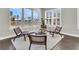 Cozy sitting area features hardwood floors, natural light from many windows and water views at 327 Tupelo Lake Dr, Summerville, SC 29486