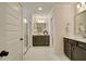 Spacious bathroom showcasing dual vanities, framed mirrors, a glass enclosed shower, and marble floors at 3307 Sawlog Dr, Summerville, SC 29486