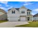 Charming two-story home features a two-car garage and inviting front porch with stylish architectural details at 3307 Sawlog Dr, Summerville, SC 29486