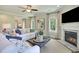 Comfortable living room features a fireplace, bright windows, and stylish decor for a cozy atmosphere at 3307 Sawlog Dr, Summerville, SC 29486