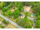 Aerial view of neighborhood, houses, and wooded areas; clear blue sky and paved roads at 346 Horseshoe Rd, Moncks Corner, SC 29461